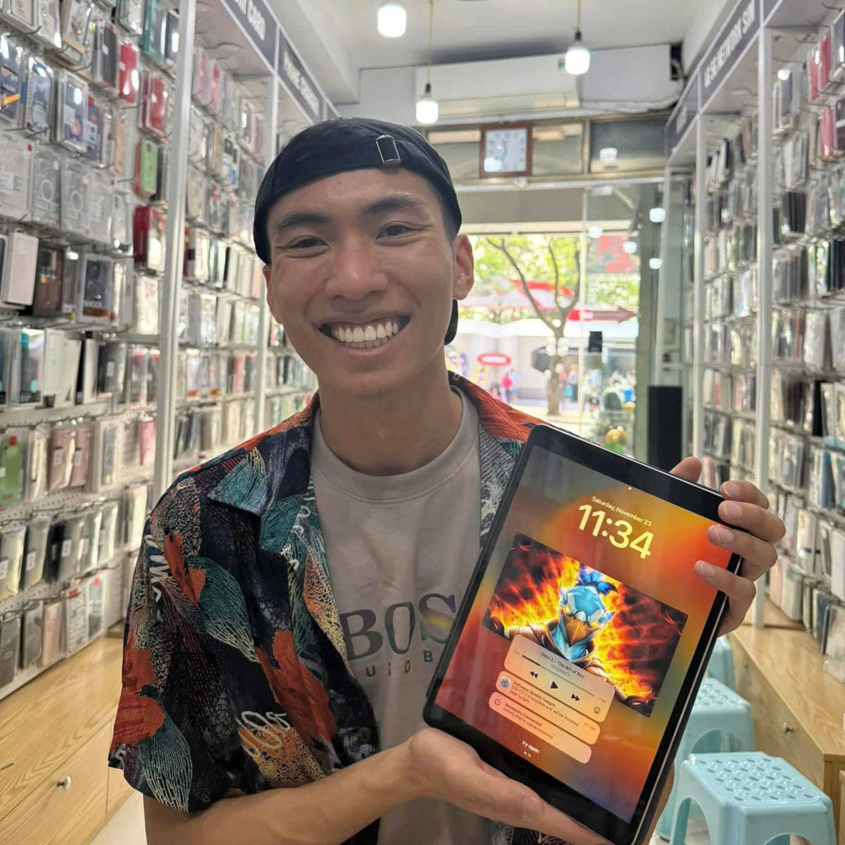 Customer reviewing iPad screen and performance after repair inside the store