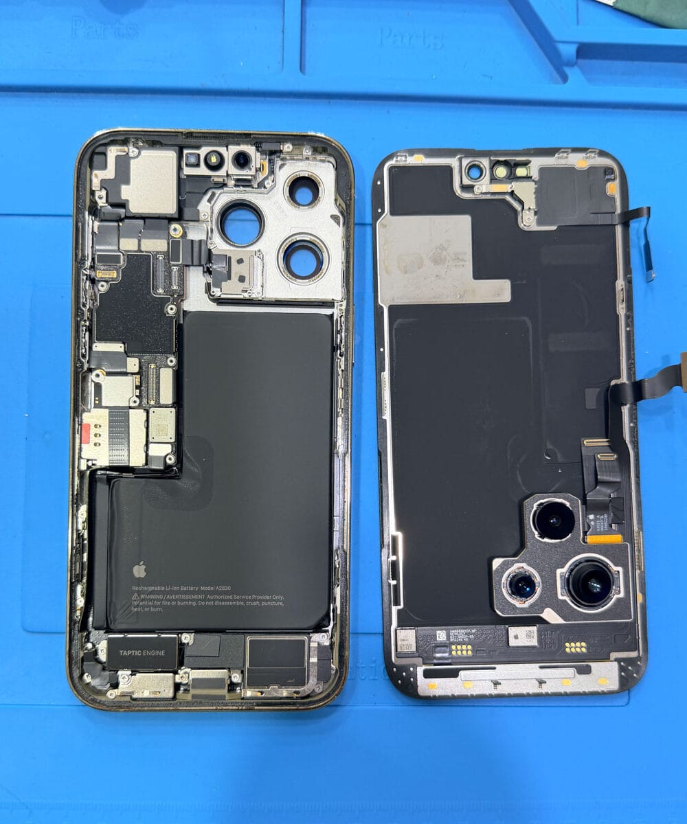 iPhone 14 Pro Max disassembled for internal moisture inspection and water damage drying
