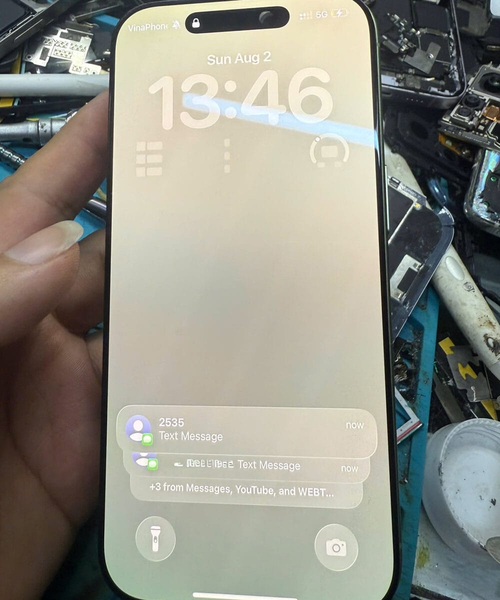 iPhone 17 logic board removed for controlled inspection after liquid exposure