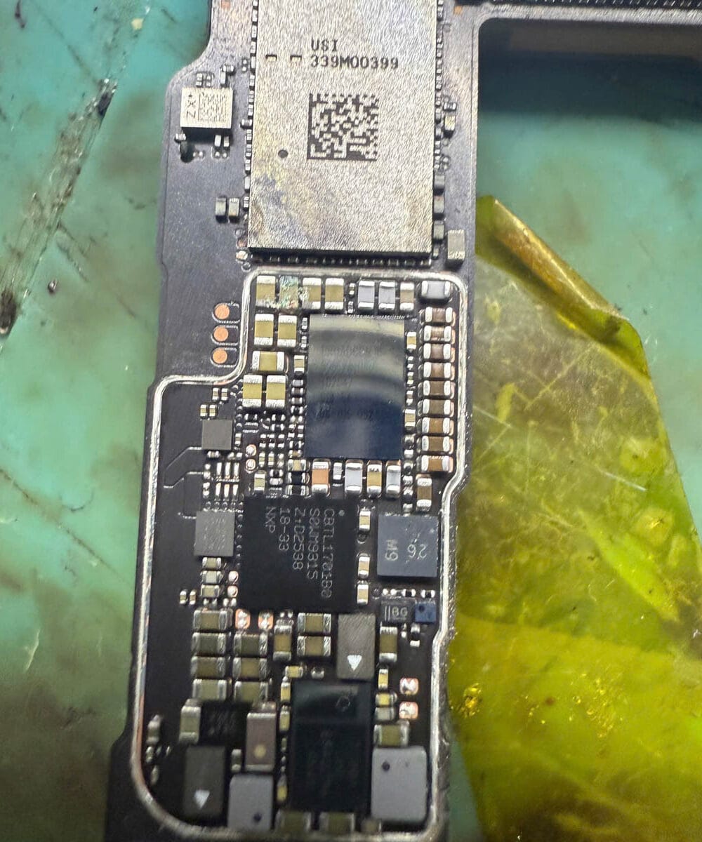 iPhone 17 logic board examined for moisture and corrosion after liquid exposure