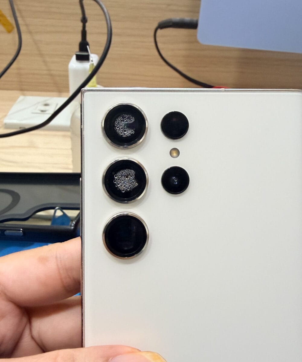 Samsung Galaxy S23 Ultra rear camera lenses with visible moisture after water exposure