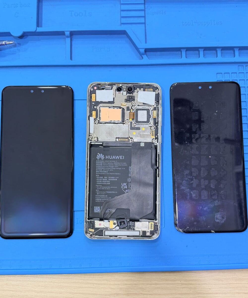 Huawei Mate 60 Pro opened for screen replacement with old and replacement display assemblies